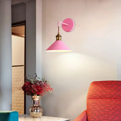 Pink conical metal sconce by Decorbites, wall-mounted with brass neck and soft illumination on Tampa Home & Garden Store