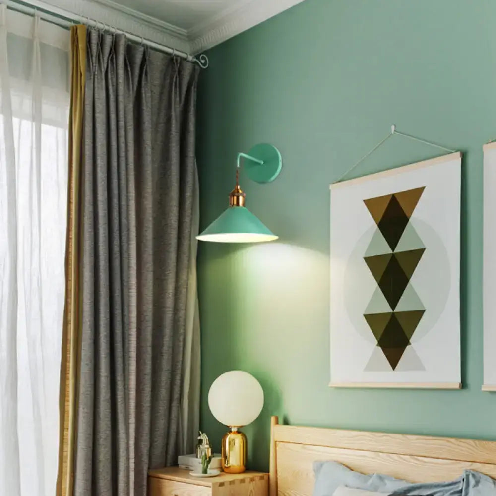 Pink conical metal sconce by Decorbites mounted on a teal bedroom wall on Tampa Home & Garden Store