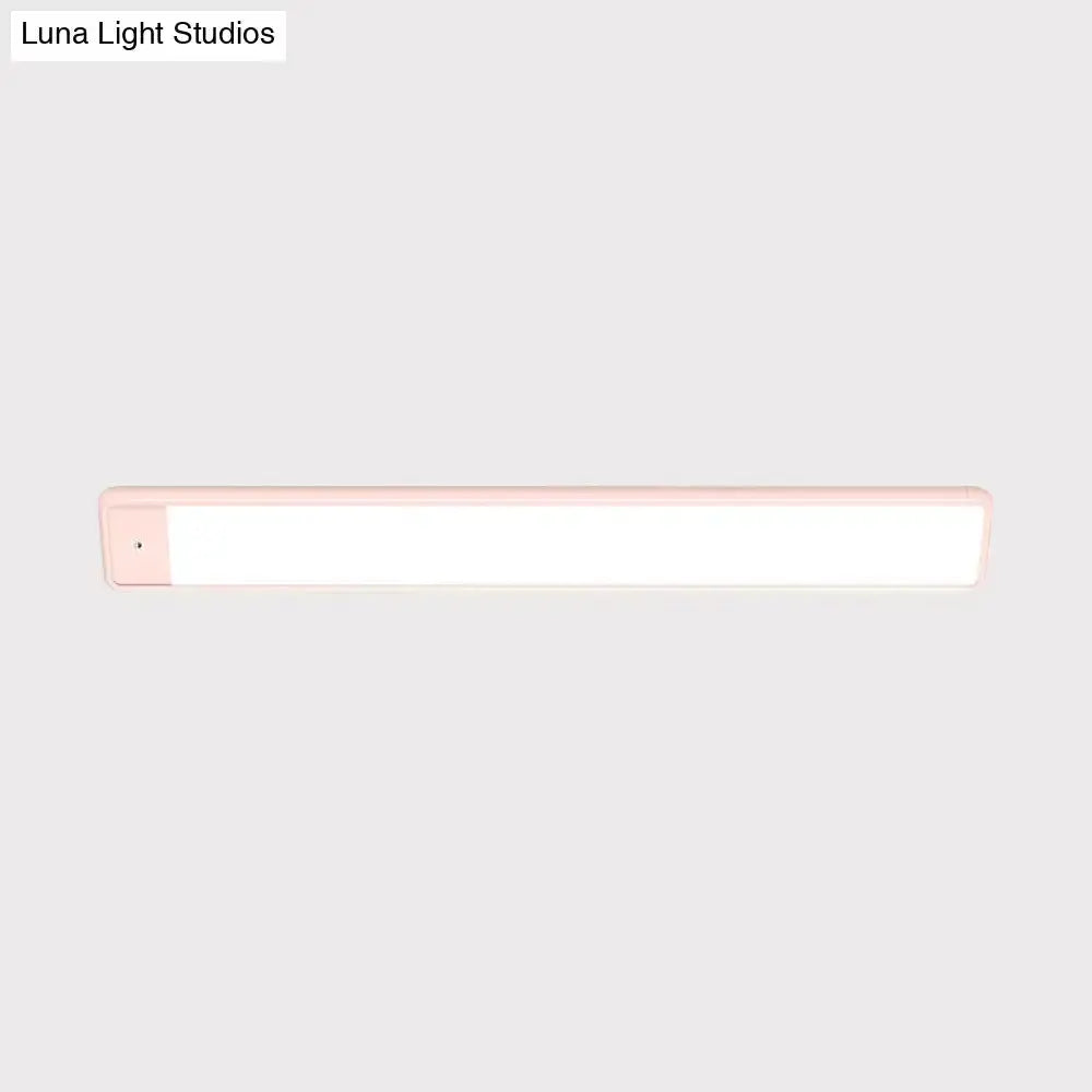 Decorbites pink elongated vanity lighting fixture for bedroom with white diffuser on Tampa Home & Garden Store