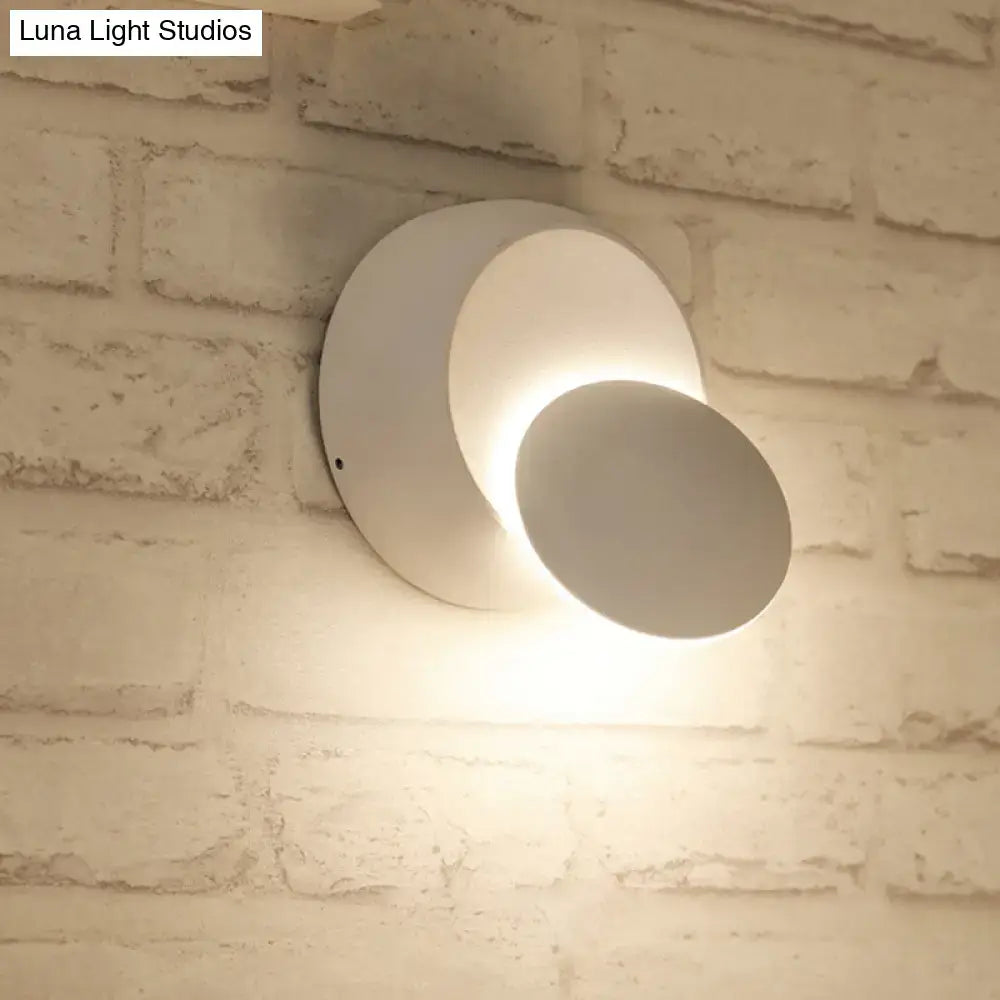 Pink Gold Circular Wall Light by Decorbites mounted on white brick wall casting warm glow on Tampa Home & Garden Store