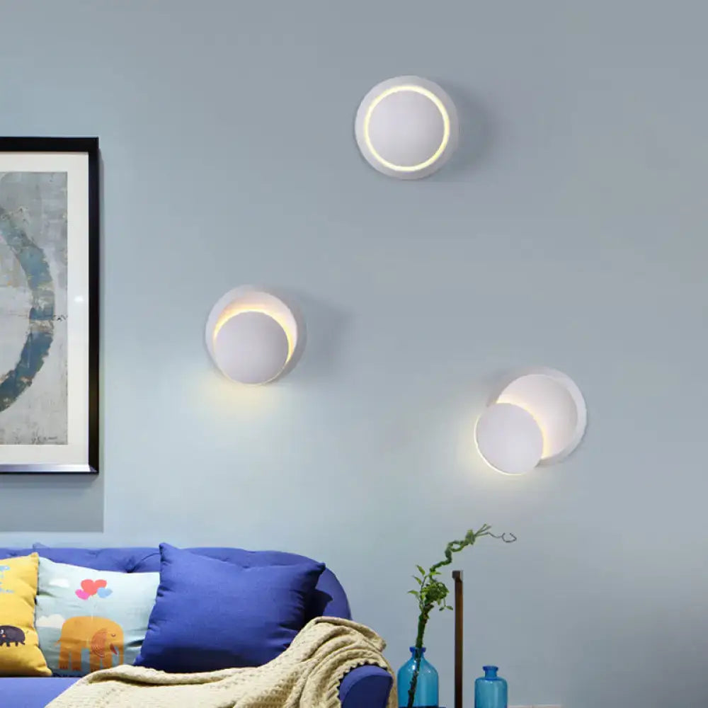 Pink gold circular wall light by Decorbites, three wall fixtures with warm halo glow on Tampa Home & Garden Store