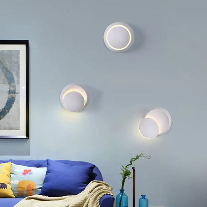 Pink gold circular wall light by Decorbites, three wall fixtures with warm halo glow on Tampa Home & Garden Store