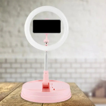 Pink metallic LED ring light with phone mount on a pink adjustable stand by Decorbites on Tampa Home & Garden Store