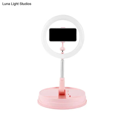 Pink LED ring light with phone holder on pink base stand on Tampa Home & Garden Store
