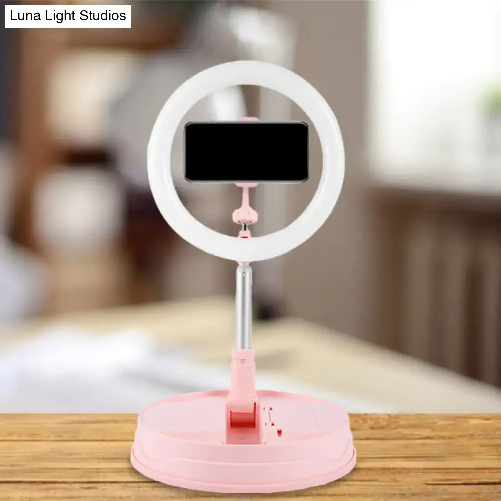 Pink metallic LED ring light with phone clamp on pink base by Decorbites on Tampa Home & Garden Store