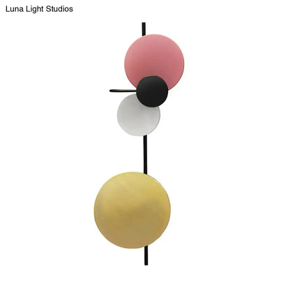 Pink Circular Wall Light by Decorbites with geometric colored discs on a black rod on Tampa Home & Garden Store