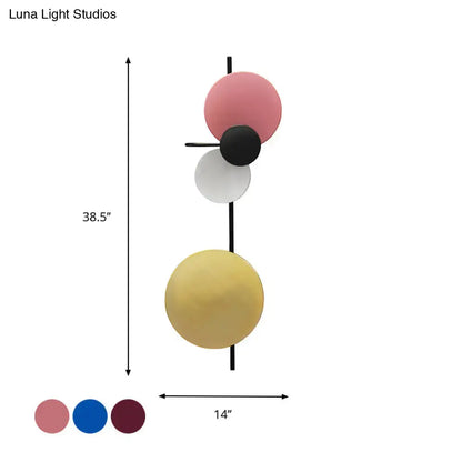 Pink circular wall light with stacked pink, black, white and yellow discs by Decorbites on Tampa Home & Garden Store