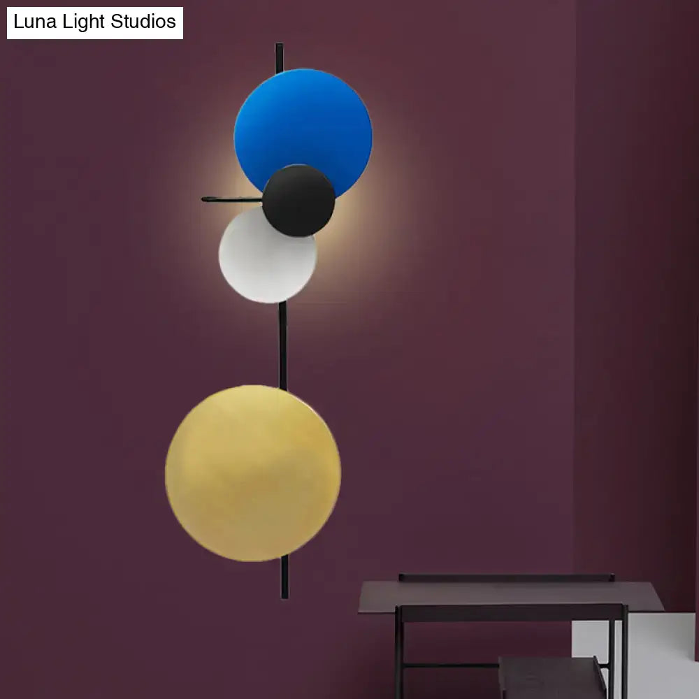 Pink Circular Wall Light with blue black white yellow discs on a black rod Luna Light on Tampa Home & Garden Store