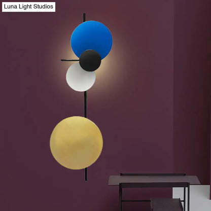Pink Circular Wall Light with blue black white yellow discs on a black rod Luna Light on Tampa Home & Garden Store