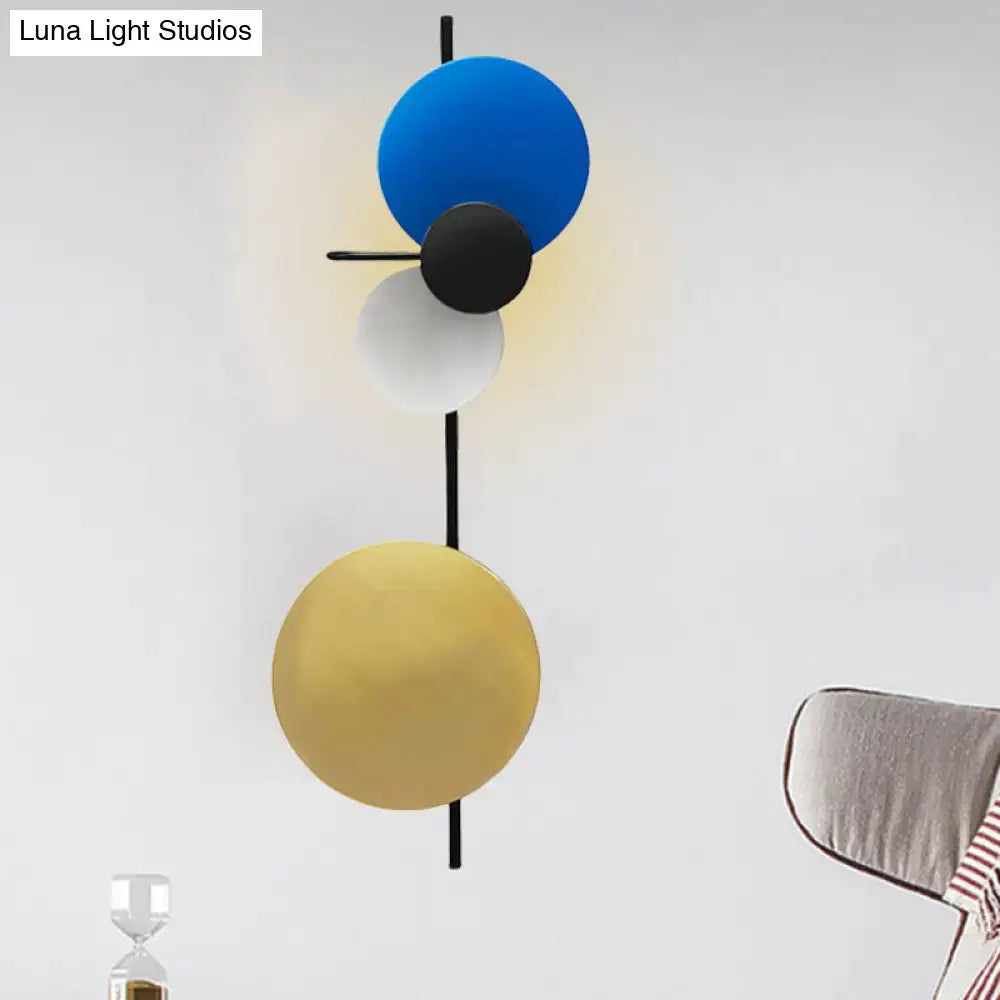 Pink circular wall light by Decorbites with discs on a slim black stem on Tampa Home & Garden Store