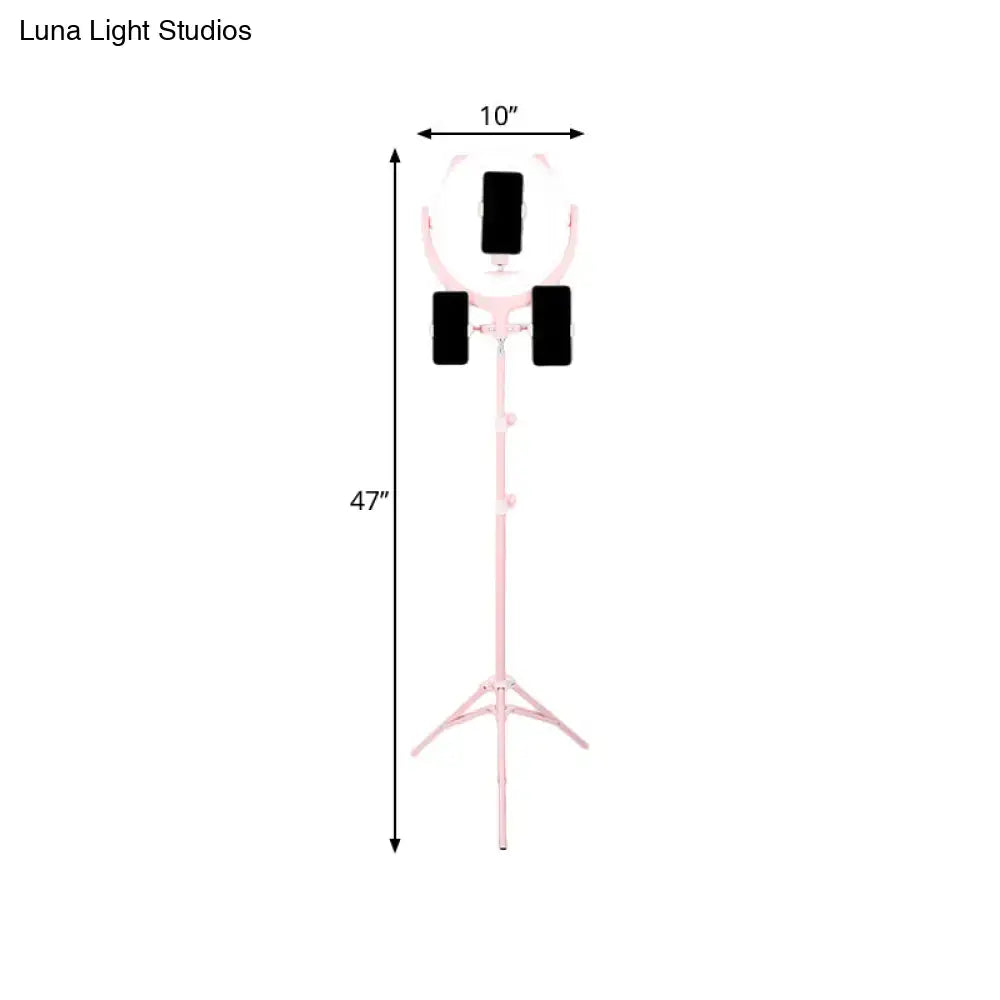 Decorbites pink triple ring light on a tall pink stand with three black phone holders on Tampa Home & Garden Store