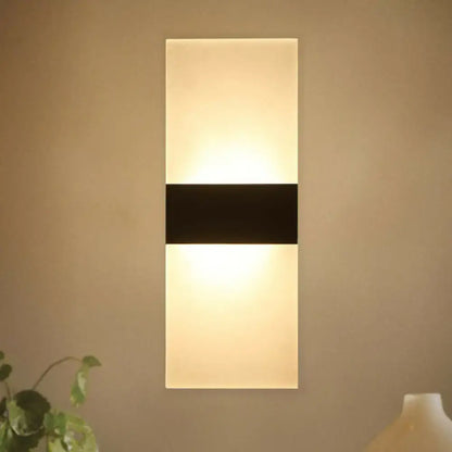 Frosted LED Wall Sconce Decorbites; frosted glass panels, black band, warm glow on Tampa Home & Garden Store