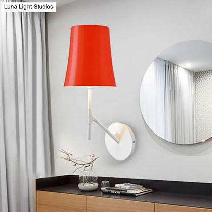 Red barrel sconce with white metal arm by Decorbites, wall light mounted beside a round mirror on Tampa Home & Garden Store
