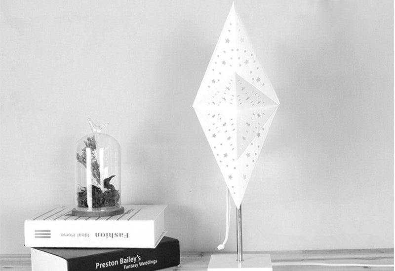 Stevvex LED desk lamp with star shade on metal stem and white base; glass cloche plant on Tampa Home & Garden Store