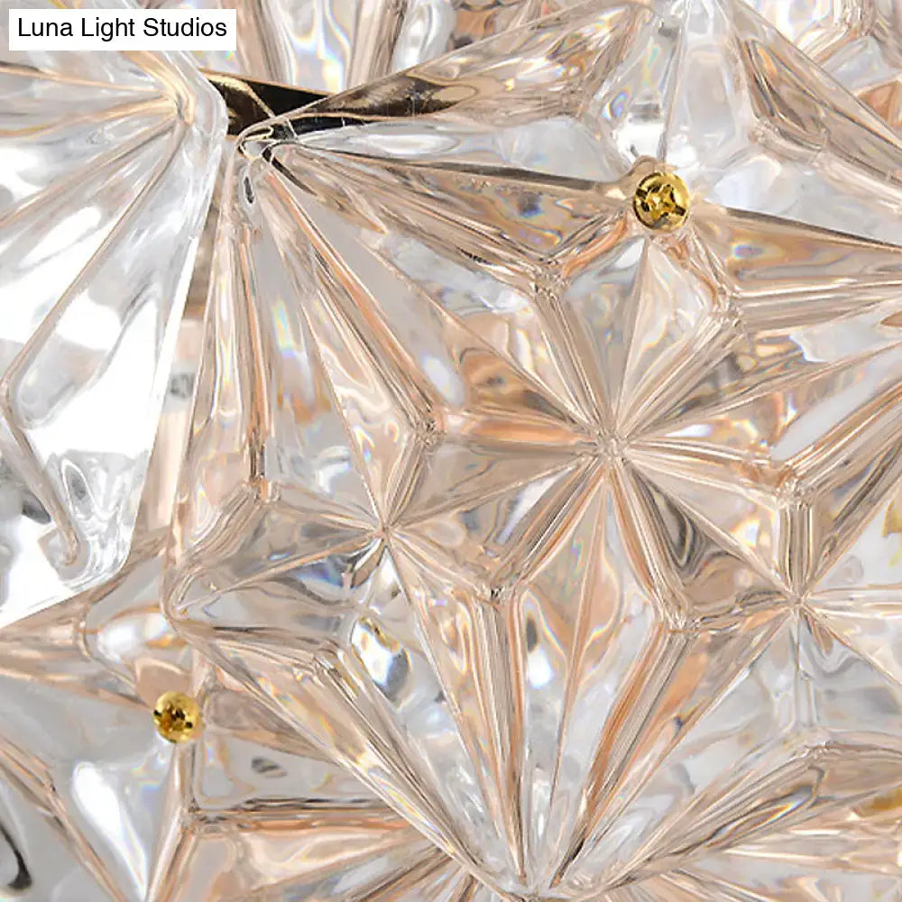 Clear crystal wall sconce with faceted geometric prisms and gold pins on Tampa Home & Garden Store