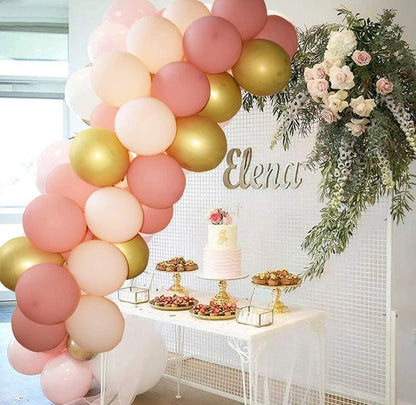 Stevvex Modern Rose Blush Pink And Gold Balloon Garland kit arch over dessert table with cake on Tampa Home & Garden Store