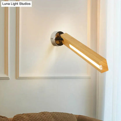 Beige wood wall light by Decorbites with angled wooden arm and metal mount, warm LED glow on Tampa Home & Garden Store