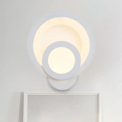 White LED wall light Decorbites with layered circular rings and warm white glow on Tampa Home & Garden Store