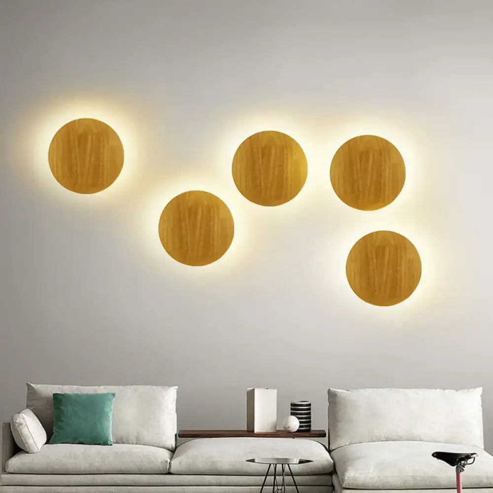 Wood LED Wall Lighting by Decorbites; five round wood discs with warm halo on wall on Tampa Home & Garden Store