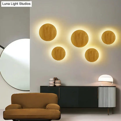 Wood LED wall lighting with six natural wood discs and warm backlit halos on Tampa Home & Garden Store