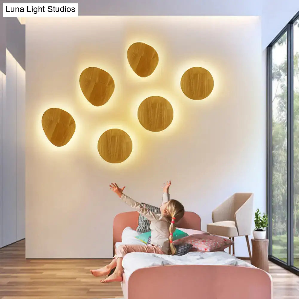 Wood LED Wall Lighting by Decorbites with warm wooden round discs mounted on wall on Tampa Home & Garden Store