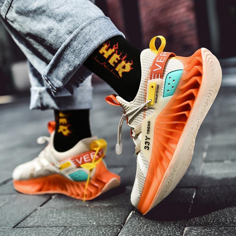 Stevvex men's modern running shoes with orange sole, cream knit upper and teal accents on Tampa Home & Garden Store
