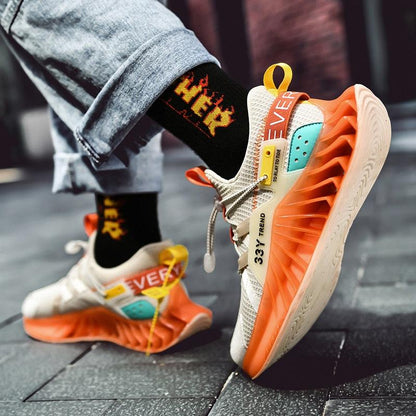 Stevvex men's modern running shoes with orange sole, cream knit upper and teal accents on Tampa Home & Garden Store
