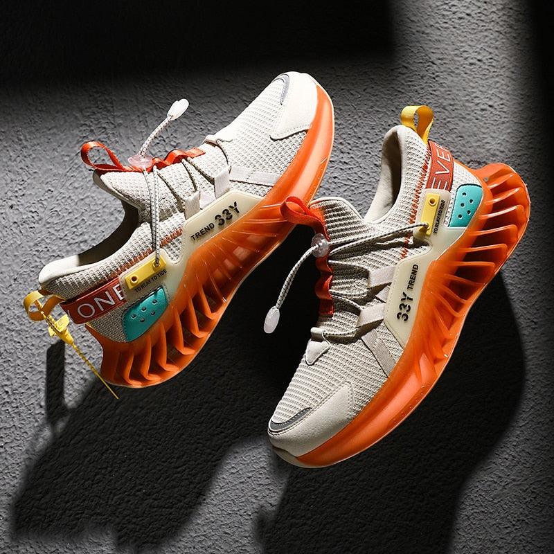 Stevvex modern running shoes, white mesh upper with bold orange sole, pair on Tampa Home & Garden Store