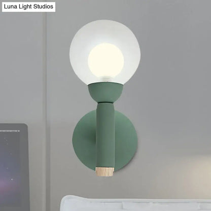 Sage Macaron Wall Sconce with green matte metal body and glass globe by Decorbites on Tampa Home & Garden Store