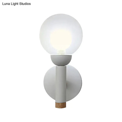 Sage Macaron Wall Sconce white glass globe on gray cylindrical body with cork accent on Tampa Home & Garden Store