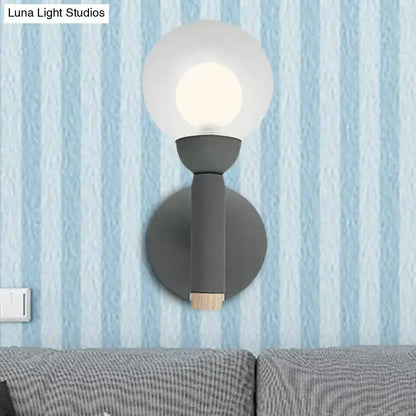 Decorbites Sage Macaron Wall Sconce, grey metal with frosted glass globe and backplate on Tampa Home & Garden Store