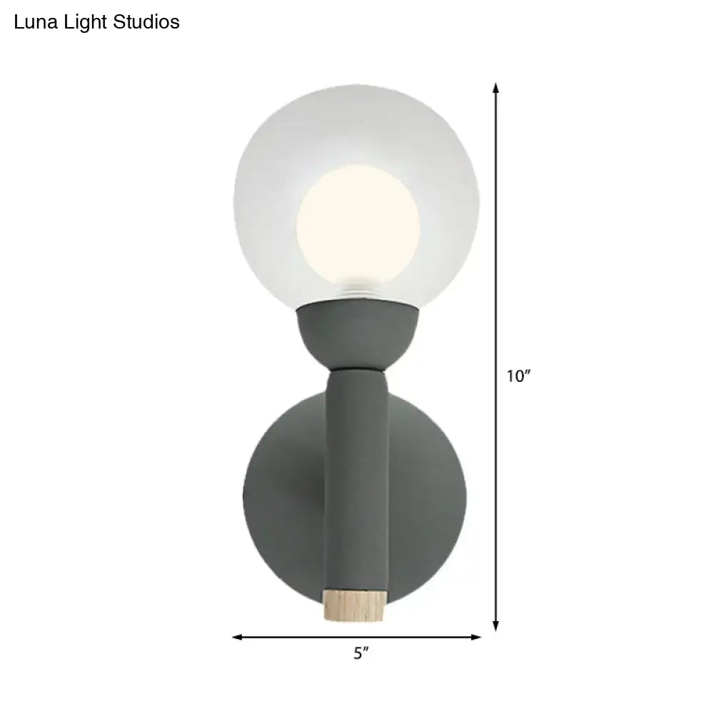 Sage Macaron Wall Sconce by Decorbites, gray-green metal wall light with round glass globe on Tampa Home & Garden Store