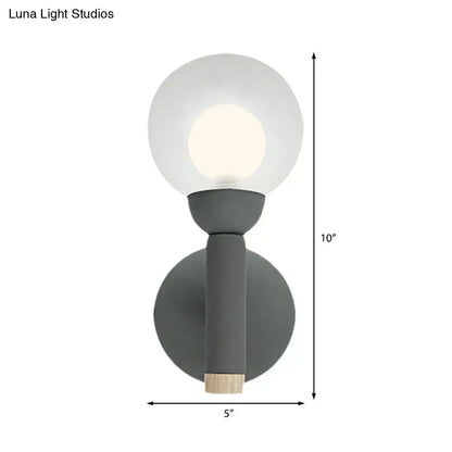 Sage Macaron Wall Sconce by Decorbites, gray-green metal wall light with round glass globe on Tampa Home & Garden Store