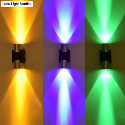 Silver aluminum wall lights by Decorbites with yellow, blue and green uplights on Tampa Home & Garden Store