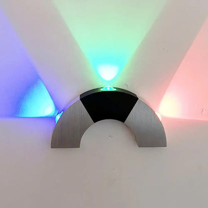Industrial RGB LED Wall Sconce Decorbites; brushed metal arc, black front, blue green red light on Tampa Home & Garden Store