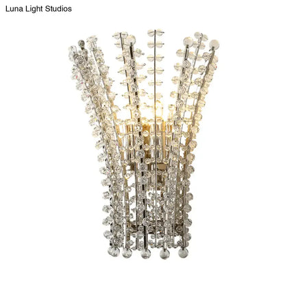Silver crystal wall sconce with hanging glass prisms and metal chrome accents by Decorbites on Tampa Home & Garden Store