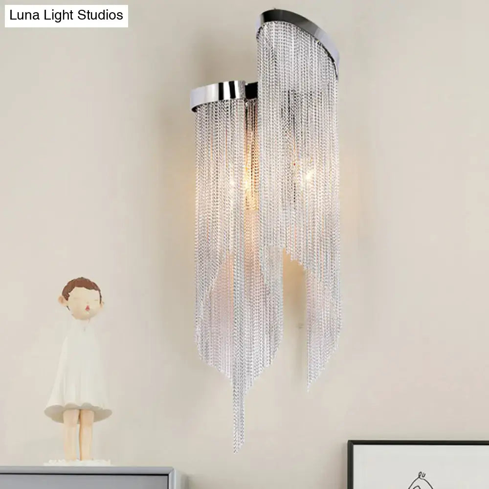 Silver crystal tassel wall light by Decorbites with cascading crystal fringe and chrome mount on Tampa Home & Garden Store