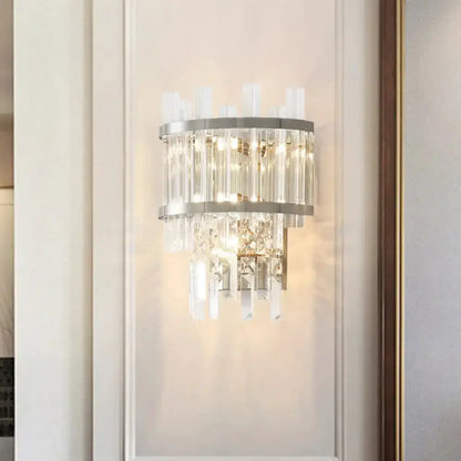 Modern silver crystal tiered wall mounted light fixture with hanging prisms by Decorbites on Tampa Home & Garden Store
