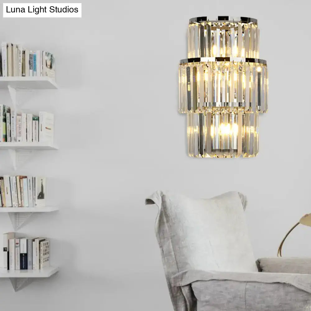 Silver Crystal Wall Sconce with tiered prisms and warm glow in a modern living room on Tampa Home & Garden Store