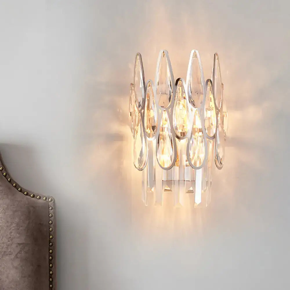 Silver Double Crystal Sconce by Decorbites with hanging teardrop prisms, warm glow on Tampa Home & Garden Store