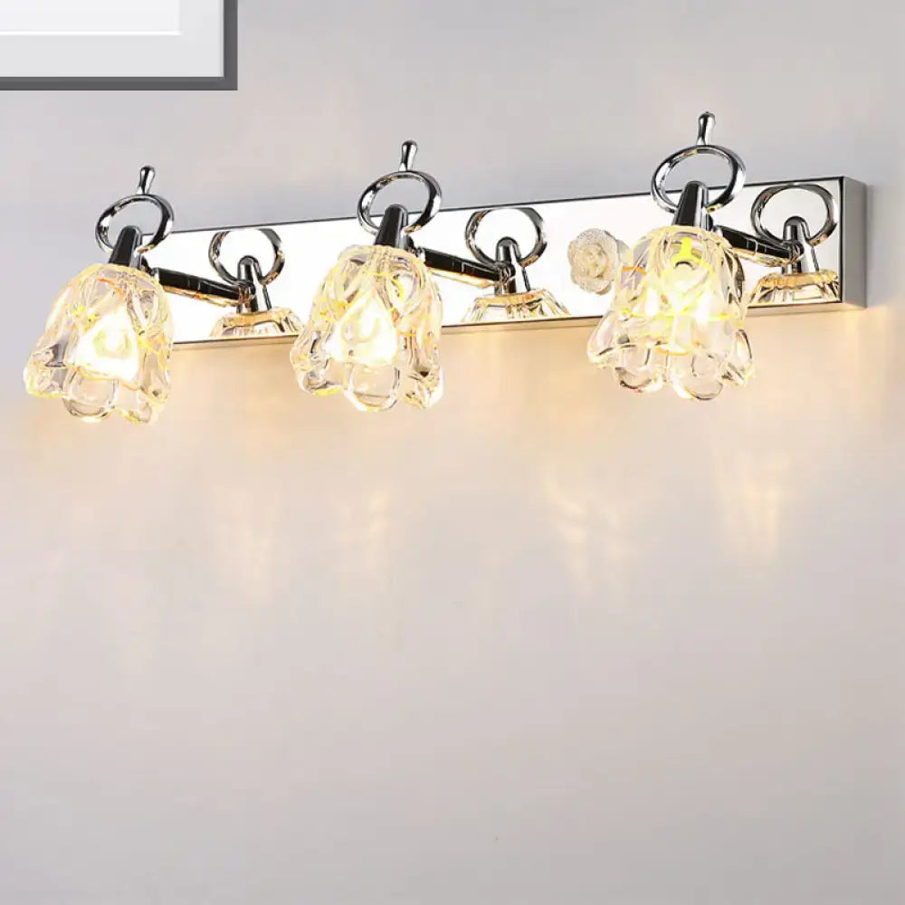 Silver glass flower light fixture with four bloom shades on a polished chrome bar on Tampa Home & Garden Store