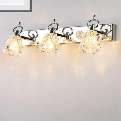 Silver glass flower light fixture with four bloom shades on a polished chrome bar on Tampa Home & Garden Store