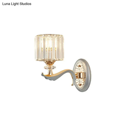 Decorbites silver crystal wall sconce, 1-2 light, with gold curved arm and faceted shade on Tampa Home & Garden Store