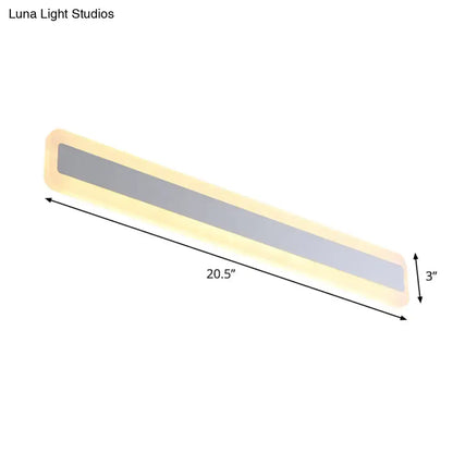 Silver elongated wall light by Decorbites with frosted center and warm glow, 20.5 in long on Tampa Home & Garden Store