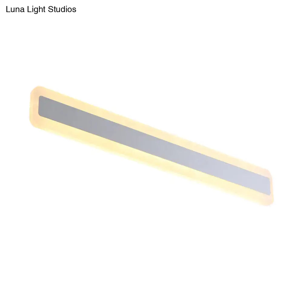 Silver Elongated Wall Light with warm LED glow, slim rectangular design on Tampa Home & Garden Store