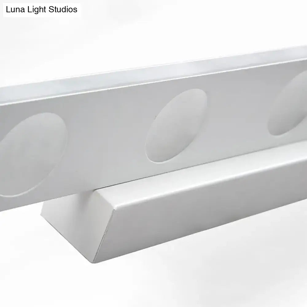 Silver oblong LED wall light with circular recessed discs along a slim metal bar on Tampa Home & Garden Store
