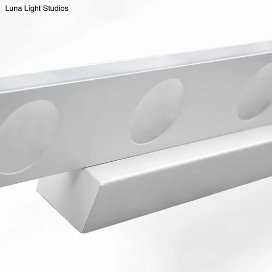 Silver oblong LED wall light with circular recessed discs along a slim metal bar on Tampa Home & Garden Store