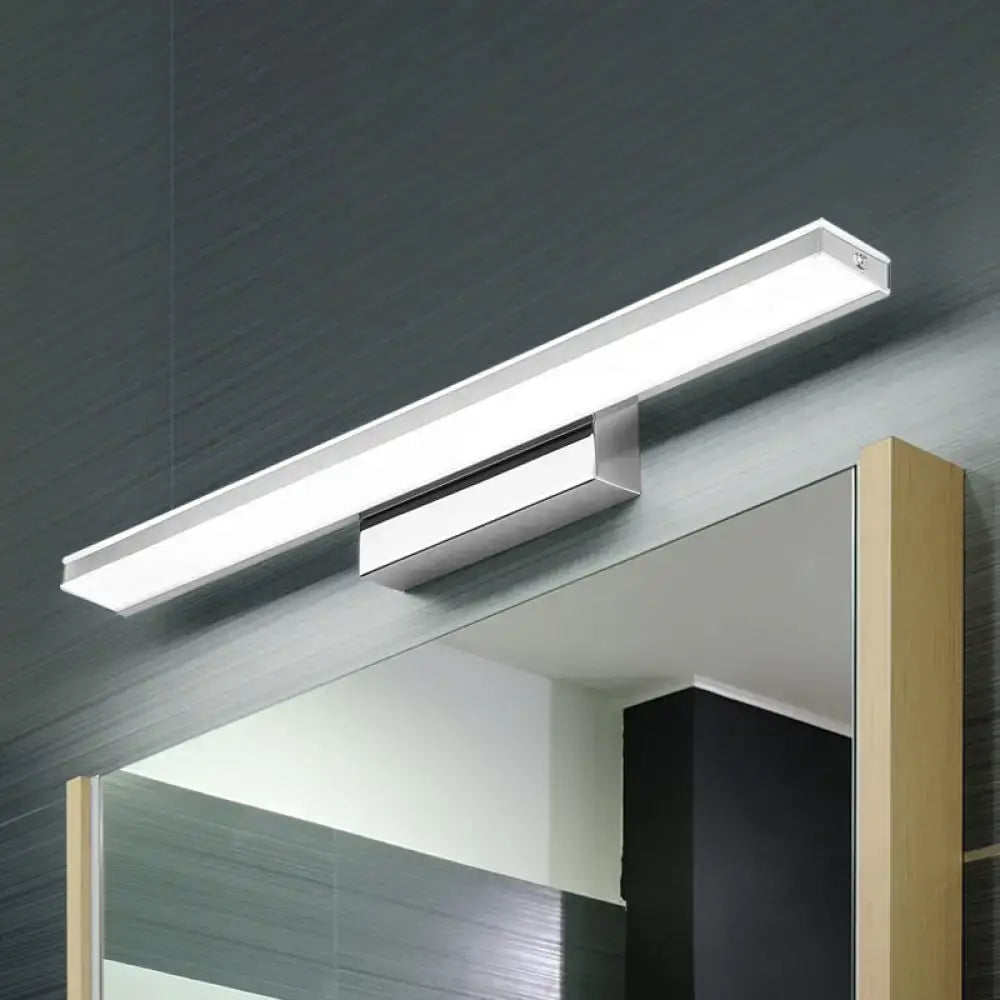 Silver slim LED wall sconce with chrome metal finish mounted above a mirror by Decorbites on Tampa Home & Garden Store