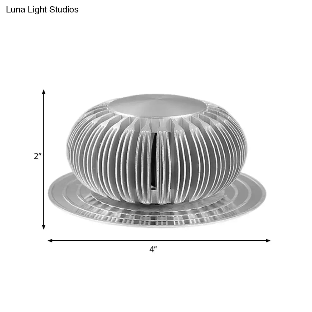 Silver Starburst Wall Sconce; silver metal orb with slotted spokes on round base on Tampa Home & Garden Store