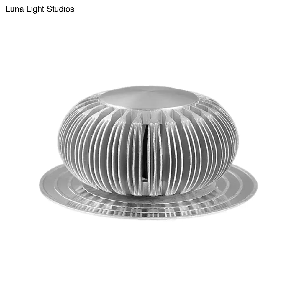 Silver Starburst Wall Sconce, round ribbed silver metal with radial fins and circular base on Tampa Home & Garden Store